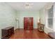 Unique bedroom with hardwood floors and antique furniture; features decorative wallpaper and a ceiling fan at 1720 Kingston Heath Way, Raleigh, NC 27604