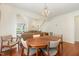 Cozy dining area open to the living room with hardwood floors at 1720 Kingston Heath Way, Raleigh, NC 27604