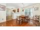 Bright dining room with hardwood floors and adjoined kitchen at 1720 Kingston Heath Way, Raleigh, NC 27604