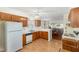 Bright kitchen with tile floors, adjoined with dining area and living room at 1720 Kingston Heath Way, Raleigh, NC 27604