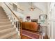 Open living area with stairs to second floor, fireplace and hardwood floors at 1720 Kingston Heath Way, Raleigh, NC 27604