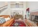Spacious living room with fireplace and staircase to the second level at 1720 Kingston Heath Way, Raleigh, NC 27604