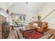 Bright living room featuring a bay window, fireplace, and hardwood floors at 1720 Kingston Heath Way, Raleigh, NC 27604