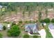 Aerial shot of home featuring lush lawns, a wooden privacy fence, and a tranquil backyard at 182 Brendamoore Ct, Fuquay Varina, NC 27526
