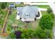 Aerial view of a green home, showcasing its backyard, landscaping, and outdoor living spaces at 182 Brendamoore Ct, Fuquay Varina, NC 27526