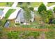 Green home with wooden privacy fence surrounding the backyard, accented with a patio and shed at 182 Brendamoore Ct, Fuquay Varina, NC 27526