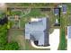 Overhead view of a home featuring a fenced backyard and a long paved driveway at 182 Brendamoore Ct, Fuquay Varina, NC 27526