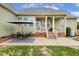 Inviting backyard patio with covered porch, perfect for entertaining or enjoying peaceful outdoor moments at 182 Brendamoore Ct, Fuquay Varina, NC 27526