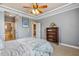 A primary bedroom with views to an en suite bathroom and a hallway to the kitchen at 182 Brendamoore Ct, Fuquay Varina, NC 27526