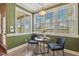 A cozy breakfast nook with bright windows and modern decor at 182 Brendamoore Ct, Fuquay Varina, NC 27526