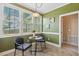 A sunny breakfast nook featuring large windows and decorative wall art at 182 Brendamoore Ct, Fuquay Varina, NC 27526