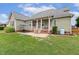 Spacious backyard featuring a covered patio, perfect for outdoor entertaining and relaxation at 182 Brendamoore Ct, Fuquay Varina, NC 27526