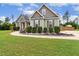 Charming, two-story home with a well-manicured lawn, lush landscaping, and a welcoming entrance at 182 Brendamoore Ct, Fuquay Varina, NC 27526