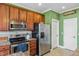 Kitchen featuring stainless appliances and ample cabinet space at 182 Brendamoore Ct, Fuquay Varina, NC 27526