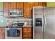 A kitchen featuring stainless steel appliances and stylish granite countertops at 182 Brendamoore Ct, Fuquay Varina, NC 27526