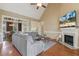 Inviting living room featuring a fireplace, hardwood floors, and vaulted ceiling at 182 Brendamoore Ct, Fuquay Varina, NC 27526