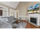 Comfortable living room with fireplace, wood floors, and neutral color palette at 182 Brendamoore Ct, Fuquay Varina, NC 27526