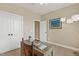 Office space with a wooden desk, lamp, and natural lighting at 182 Brendamoore Ct, Fuquay Varina, NC 27526