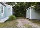 Backyard showing the exterior of a shed with a gravel driveway at 200 S Pettigrew St, Raleigh, NC 27610