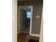 Bathroom view through a doorway featuring tiled floors, toilet, and sink area at 200 S Pettigrew St, Raleigh, NC 27610
