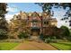 Exterior view of a beautiful home, landscape, and stone pathway at 200 S Pettigrew St, Raleigh, NC 27610