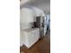 The kitchen features white cabinets, stainless steel appliances, and a stylish backsplash at 200 S Pettigrew St, Raleigh, NC 27610
