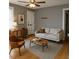 Cozy living room with neutral walls, a light sofa, wood furniture, and ample natural light at 200 S Pettigrew St, Raleigh, NC 27610
