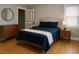 Relaxing main bedroom with natural light, warm wood floors, and serene decor at 200 S Pettigrew St, Raleigh, NC 27610