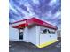 Exterior front of Jack's Restaurant with bright red awnings and white siding at 200 S Pettigrew St, Raleigh, NC 27610