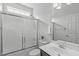 Bathroom features a combination shower and tub with glass doors, a toilet, and a vanity at 2003 Red Sage Ct, Apex, NC 27502