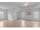 Spacious bedroom with neutral paint, light flooring, recessed lighting, three windows, and a ceiling fan at 2003 Red Sage Ct, Apex, NC 27502