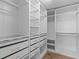 Walk-in closet with custom shelving and drawers, providing ample storage and organization at 2003 Red Sage Ct, Apex, NC 27502