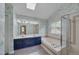 Primary bathroom featuring double vanity sinks, soaking tub, shower and tiled floors at 203 N Becket St, Cary, NC 27513