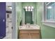 Stylish half bathroom with a sink vanity and neutral tones at 203 N Becket St, Cary, NC 27513