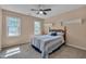 Cozy bedroom features carpet floors, two windows and ceiling fan at 203 N Becket St, Cary, NC 27513