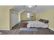 Bright bedroom with wood floors, sloped ceilings, a storage chest, and a modern work desk at 203 N Becket St, Cary, NC 27513