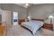Bright bedroom with vaulted ceilings, carpet floors, two windows and ample closet space at 203 N Becket St, Cary, NC 27513