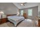 Bright bedroom with vaulted ceilings, carpet floors, two windows and ample closet space at 203 N Becket St, Cary, NC 27513