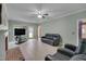 Spacious living room features tile floors, fireplace, ceiling fan, and lots of natural light at 203 N Becket St, Cary, NC 27513