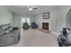 Living room with brick fireplace and access to outdoor patio through glass doors at 203 N Becket St, Cary, NC 27513