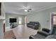 Spacious living room features tile floors, fireplace, ceiling fan, and lots of natural light at 203 N Becket St, Cary, NC 27513