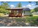 Backyard featuring covered porch and partial view of the house at 2213 Stephanie Ln, Clayton, NC 27520