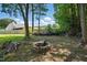 Spacious backyard with fire pit and fencing, perfect for outdoor enjoyment at 2213 Stephanie Ln, Clayton, NC 27520