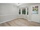Dining area featuring wood floors, bay window and a view of the outdoors at 2213 Stephanie Ln, Clayton, NC 27520