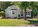 Cozy home featuring a bay window and inviting front yard landscaping at 2213 Stephanie Ln, Clayton, NC 27520