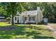 Charming single-story home featuring a well-manicured lawn and mature trees at 2213 Stephanie Ln, Clayton, NC 27520