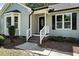 Inviting front entrance with brick steps and decorative door at 2213 Stephanie Ln, Clayton, NC 27520