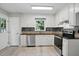 Well-lit kitchen boasts stainless steel appliances and light countertops at 2213 Stephanie Ln, Clayton, NC 27520