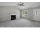 Spacious living room with fireplace and an abundance of natural light at 2213 Stephanie Ln, Clayton, NC 27520
