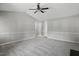 Open-concept living room with neutral tones, fireplace and carpet flooring at 2213 Stephanie Ln, Clayton, NC 27520